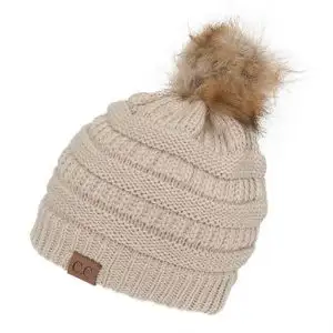 女士(前面)蝴蝶结小帽是冬季最受欢迎的女士小圆帽之一.