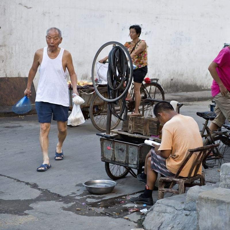 可以组成一个联盟,类似丐帮什么的,因为全国的修车摊似乎都长一个样